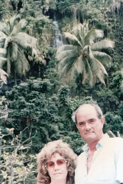 Mario R. Alvarez, Sr. in front of tropical jungle