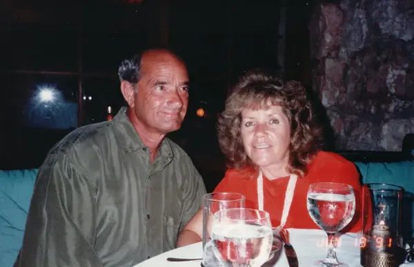 Mario R. Alvarez, Sr. at a candlelit dinner